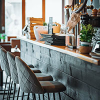 empty bar stools in a outdoor mall restaurant 