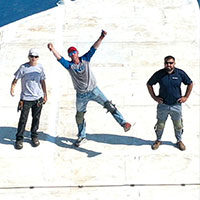 a group of roofers posing together