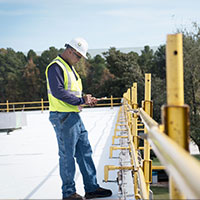 construction foreman is going through checklist