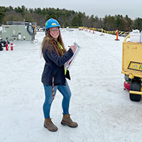 smiling female commercial roofing safety professional with a clip board